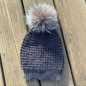 Gray knit hat with fox fur pompom